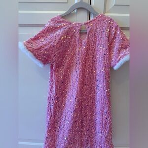 Brand new sequin dress with faux fur sleeve and bottom